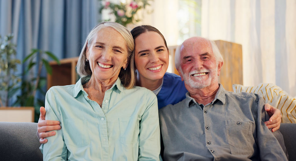 Senior couple, portrait smile and nurse for healthcare, medical support and retirement in nursing home.